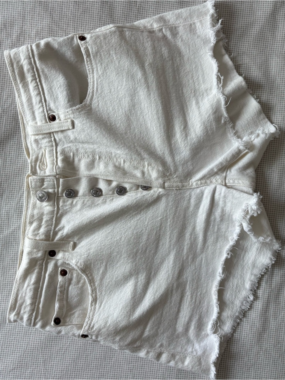 Levi’s Button-Fly White Denim Jean Shorts with Frayed Hem